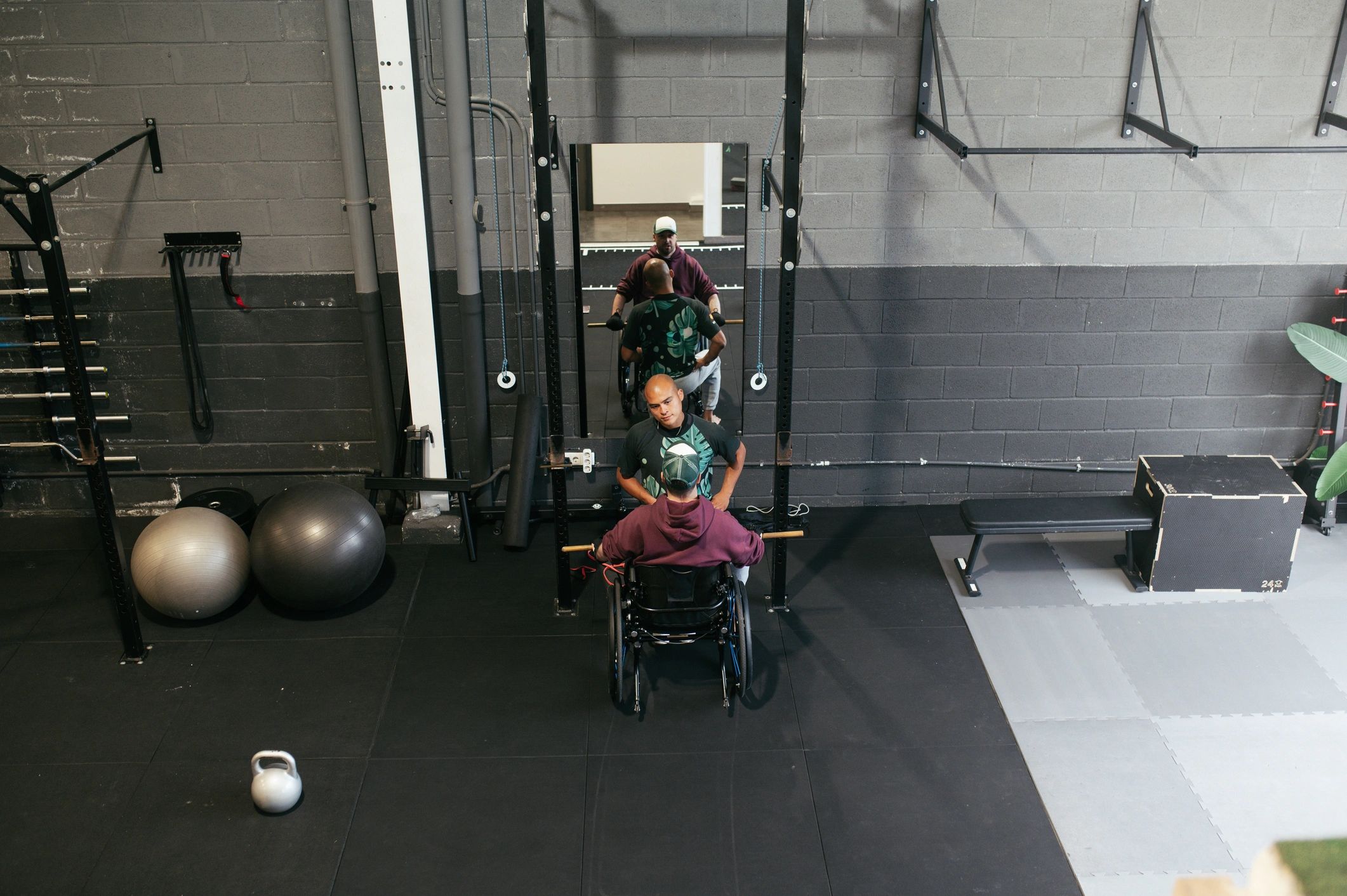 Inclusive fitness gym with adaptive training equipment